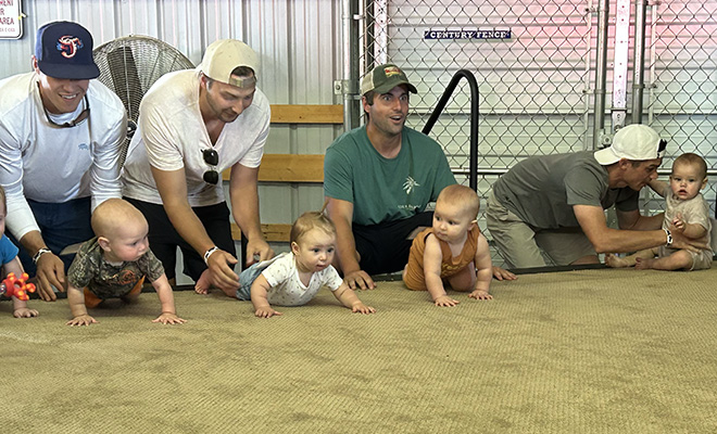 dads prep their babies for the Carver County Fair diaper derby