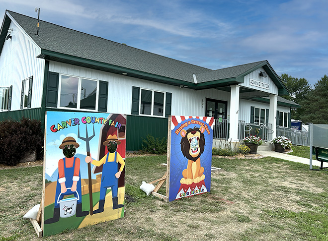 farmers and lion photo board cutouts ready for a photo op outside the Carver County Fair Administration Building