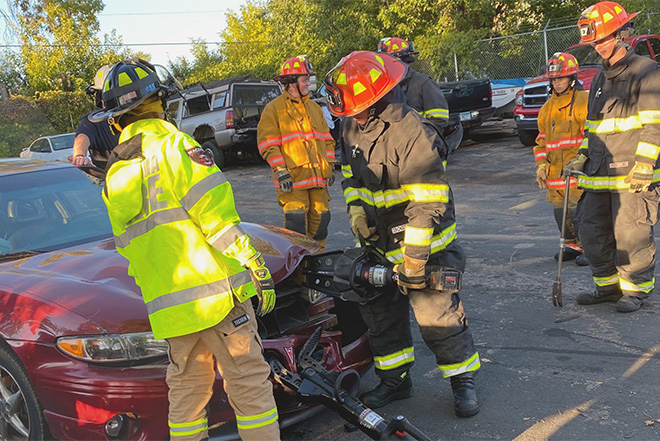 Waconia and South West Carver County Fire Explorers demonstrate cutting open a car