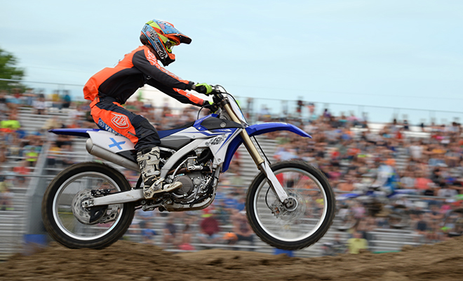 a motokazie racer gets air on a jump at the Carver County Fair grandstand