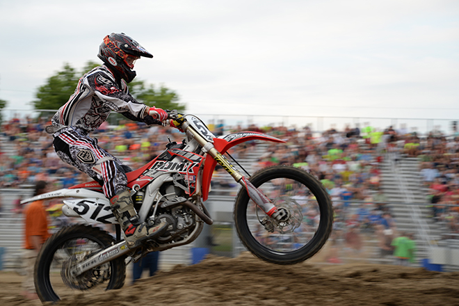 A motocross rider gets air on a jump at the Carver County Fair Grandstand
