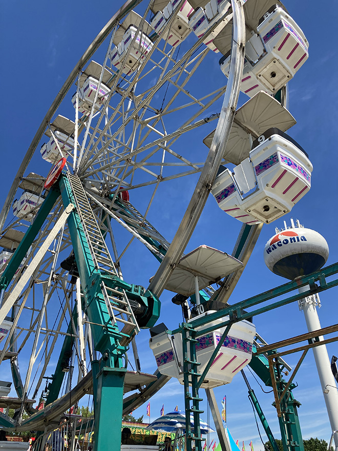 Ferris wheel and Waconia water tower at the Carver County Fair midway