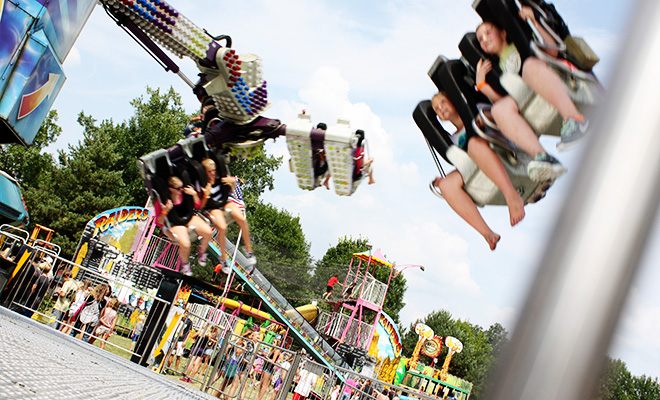 kids on a wild ride on the midway at the Carver County Fair