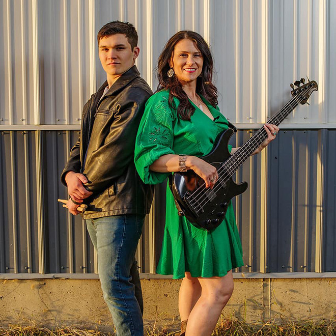 Green River drummer and bass player pose for a photo