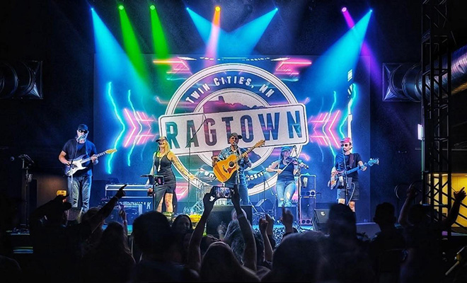 Ragtown performs live on stage with colorful lights