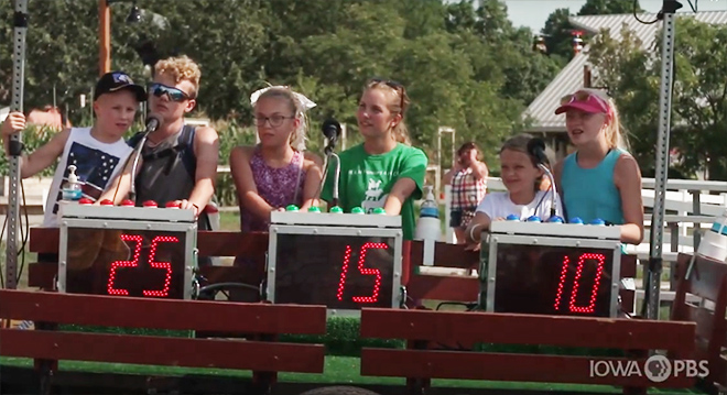 Kids playing Wheels of Agriculture game show